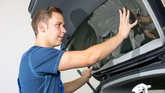 A window being replaced on a car